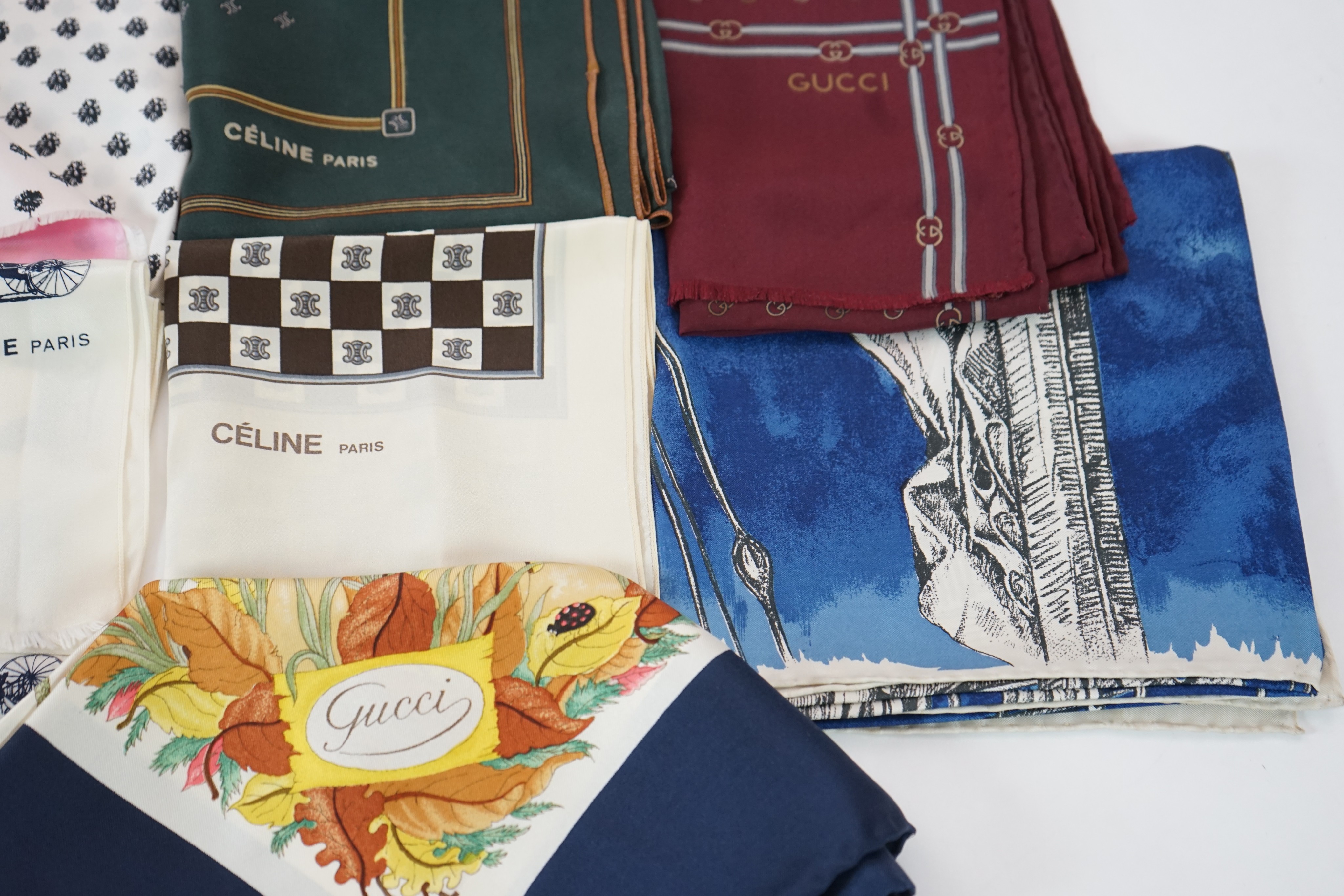 Three Gucci silk scarves, two by Celine and one by Balenciaga